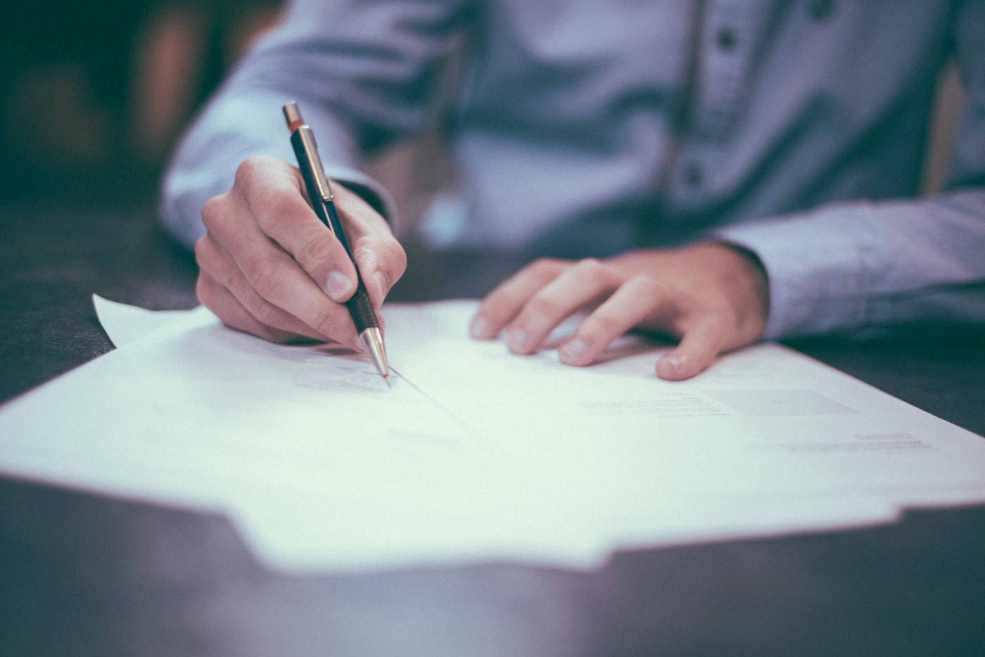 Documents and pen on a desk